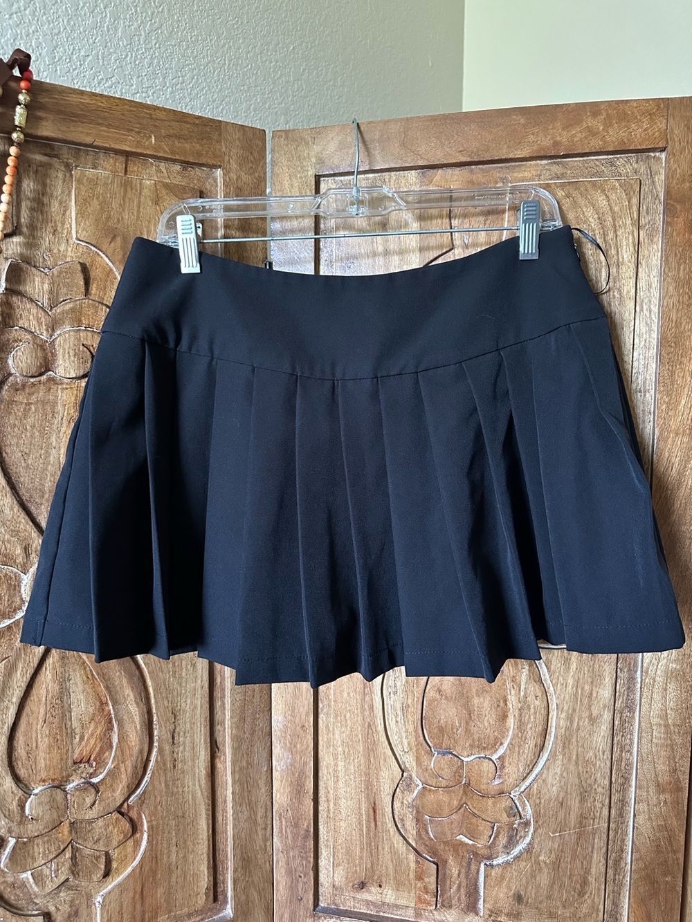 Emerson Lang pleated black mini skirt.